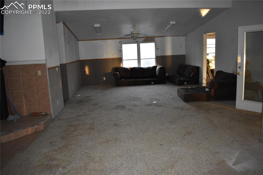 9250 County Road East Olney Springs, CO 81062 - Photo 31 of 32 a living room with furniture and a large window