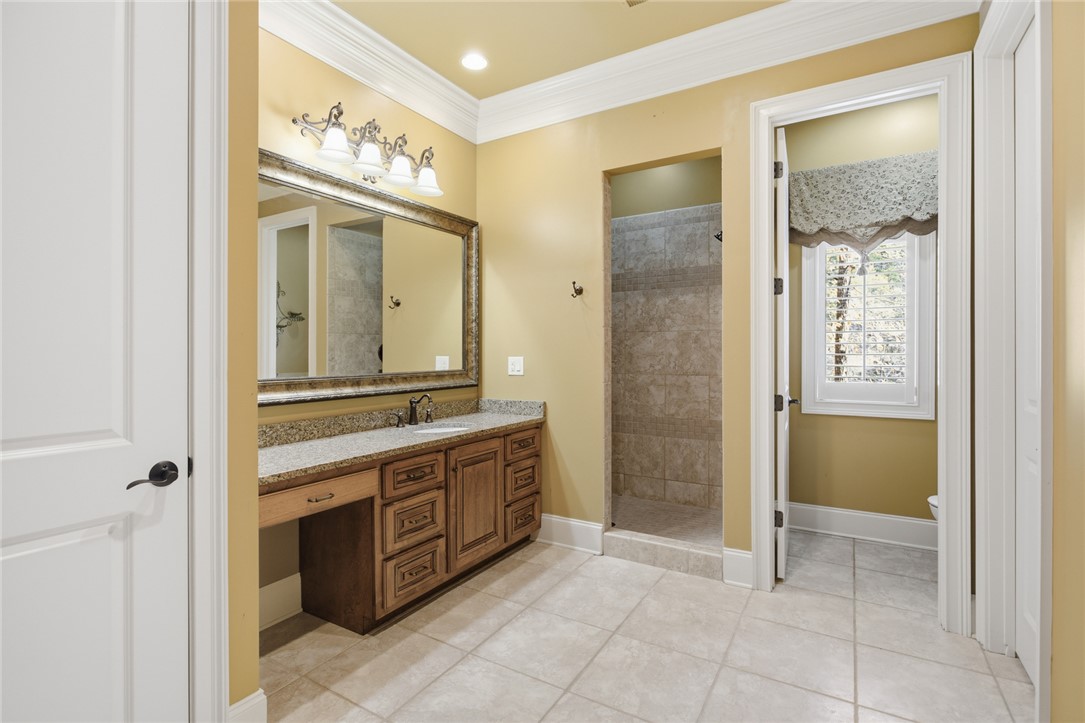 610 Highridge Drive Seneca, SC 29672 - Photo 37 of 50 This bathroom features a single vanity, a spacious shower, and elegant tile flooring.