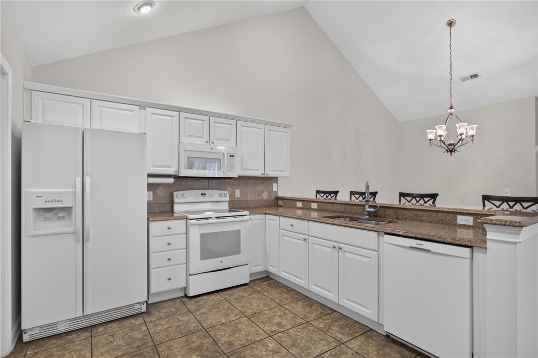 134 Life Style Lane Anderson, SC 29621 - Photo 2 of 44 Prepare meals in this kitchen, boasting vaulted ceilings and ample counter space.