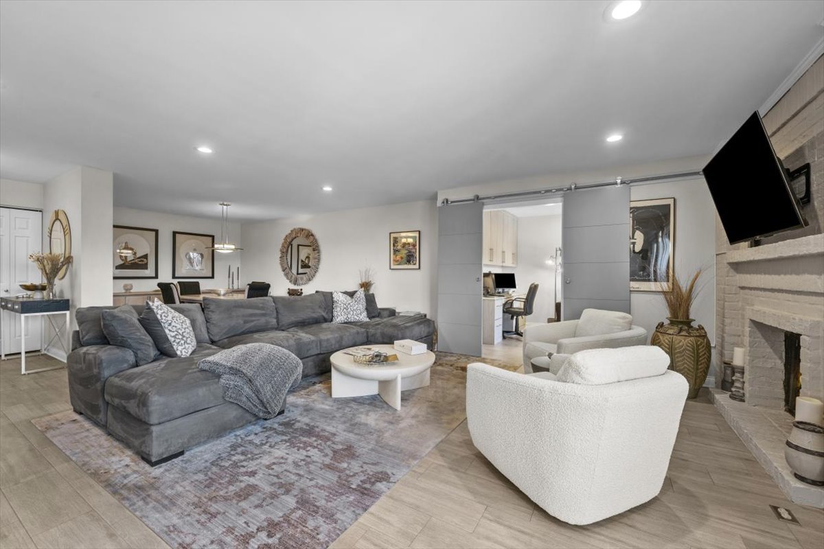 3741 Mission Hills Road, Unit 410 Northbrook, IL 60062 - Photo 11 of 21 a living room with furniture and a flat screen tv