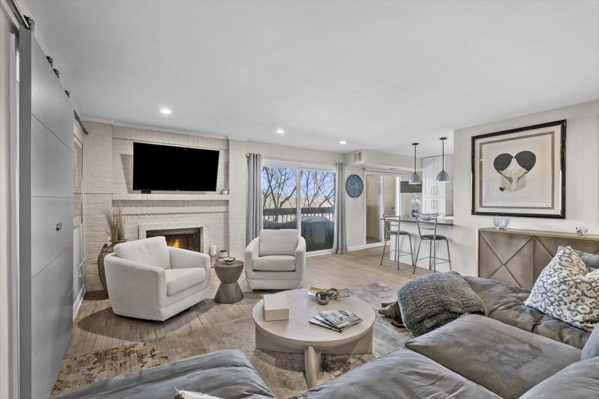 3741 Mission Hills Road, Unit 410 Northbrook, IL 60062 - Photo 12 of 21 a living room with furniture and a flat screen tv
