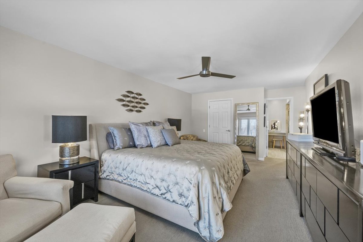 3741 Mission Hills Road, Unit 410 Northbrook, IL 60062 - Photo 16 of 21 a bedroom with a bed and a flat screen tv