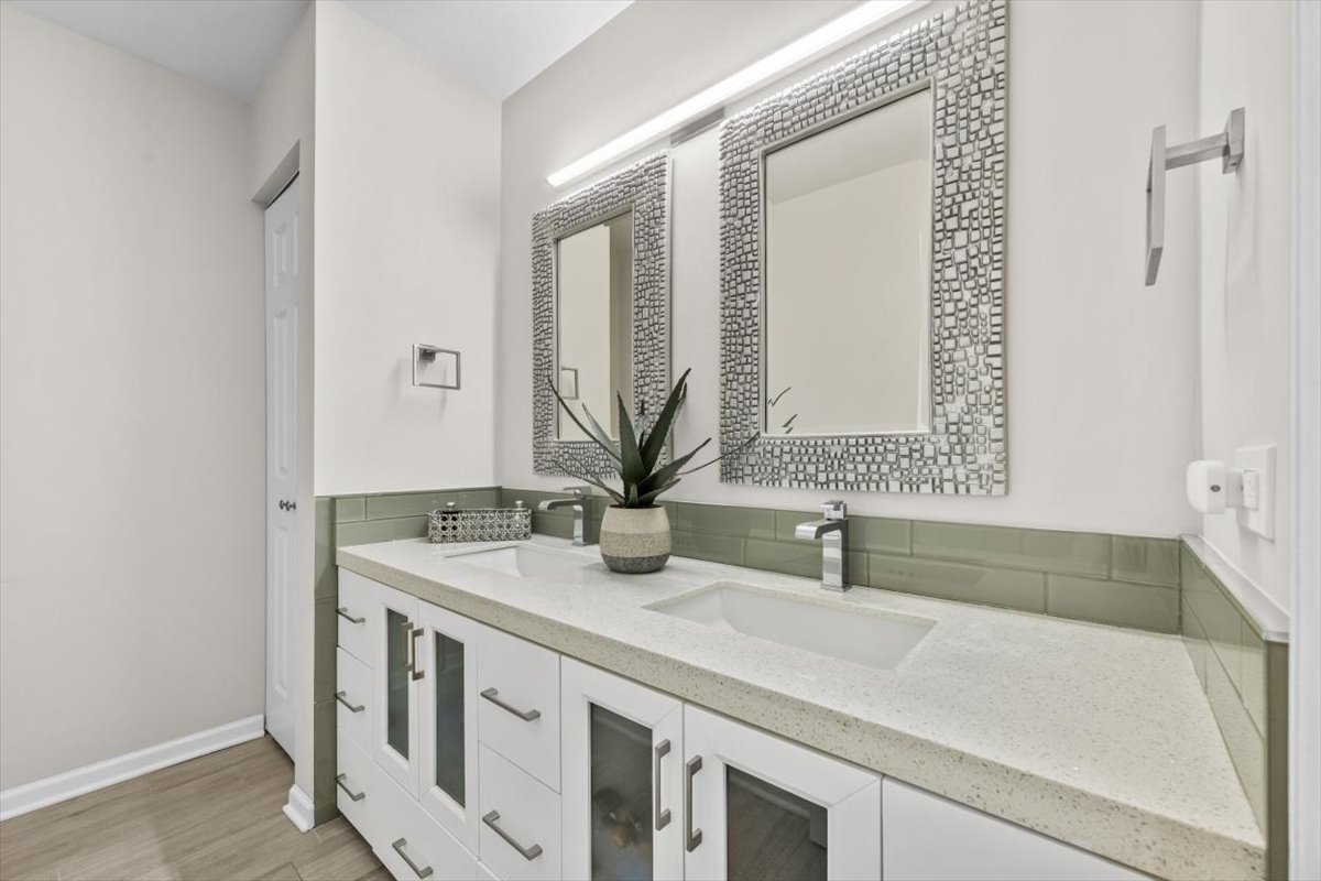 3741 Mission Hills Road, Unit 410 Northbrook, IL 60062 - Photo 17 of 21 a bathroom with a sink and a mirror