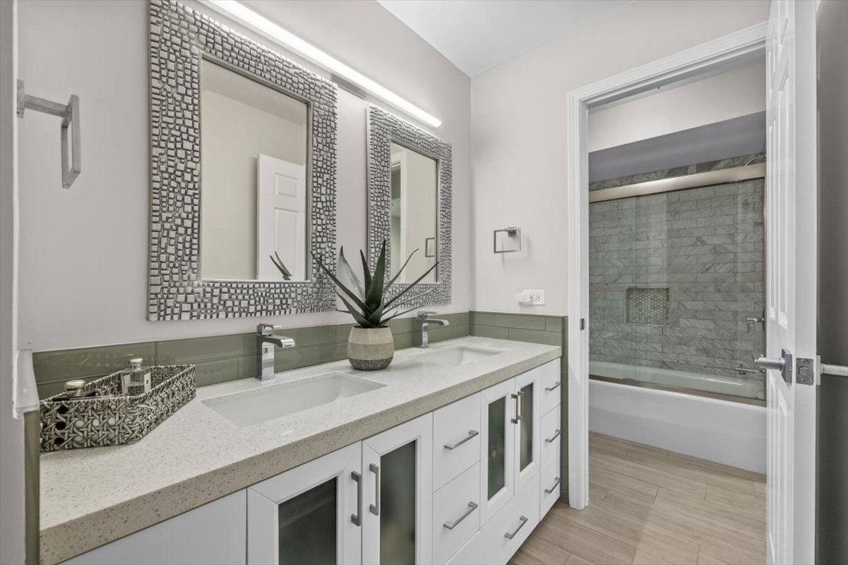 3741 Mission Hills Road, Unit 410 Northbrook, IL 60062 - Photo 18 of 21 a bathroom with a sink a vanity and a mirror