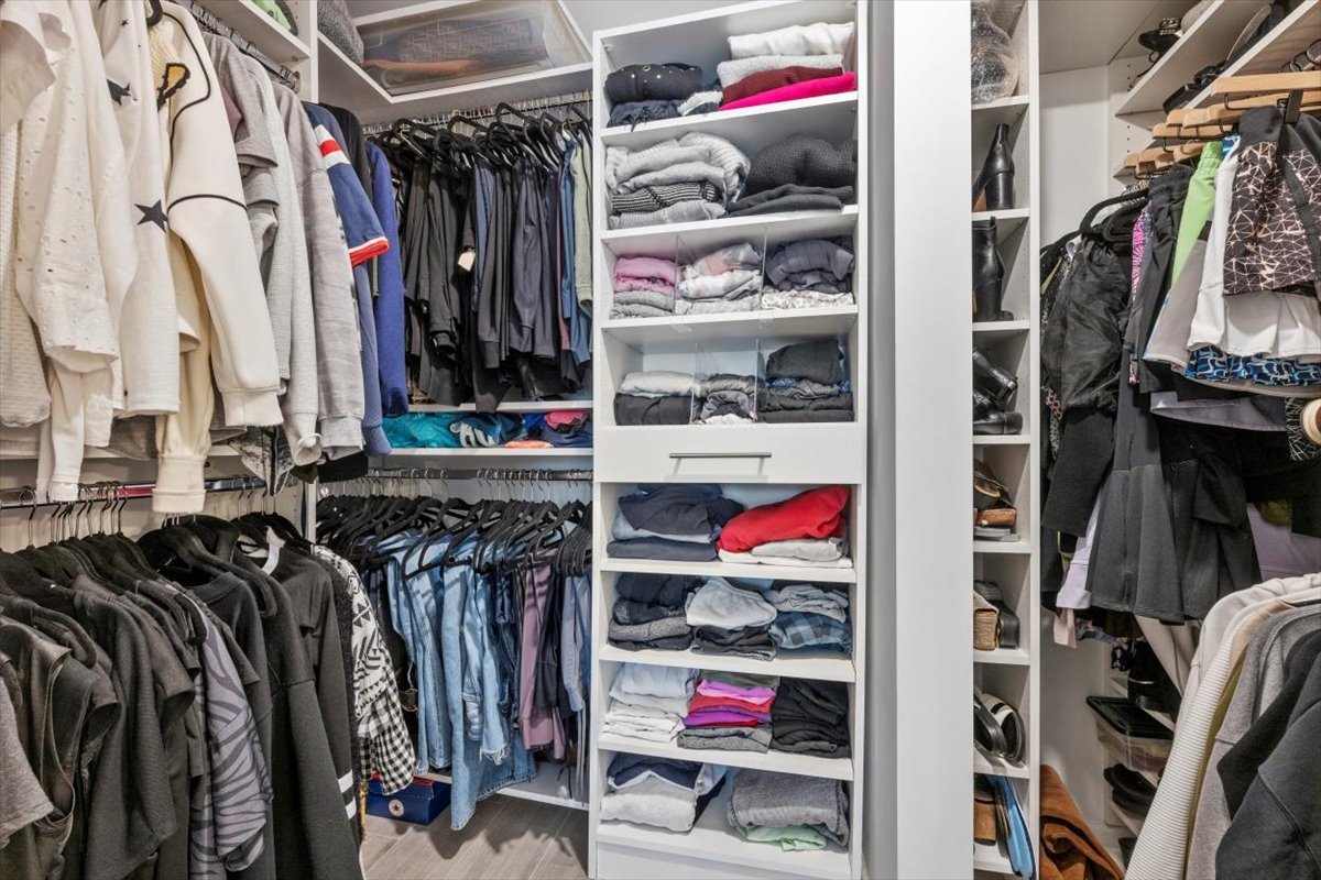 3741 Mission Hills Road, Unit 410 Northbrook, IL 60062 - Photo 19 of 21 a view of walk in closet with clothes and shoes
