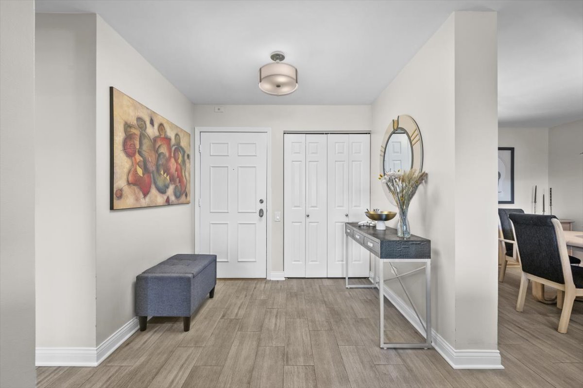 3741 Mission Hills Road, Unit 410 Northbrook, IL 60062 - Photo 2 of 21 a living room with furniture and a wooden floor