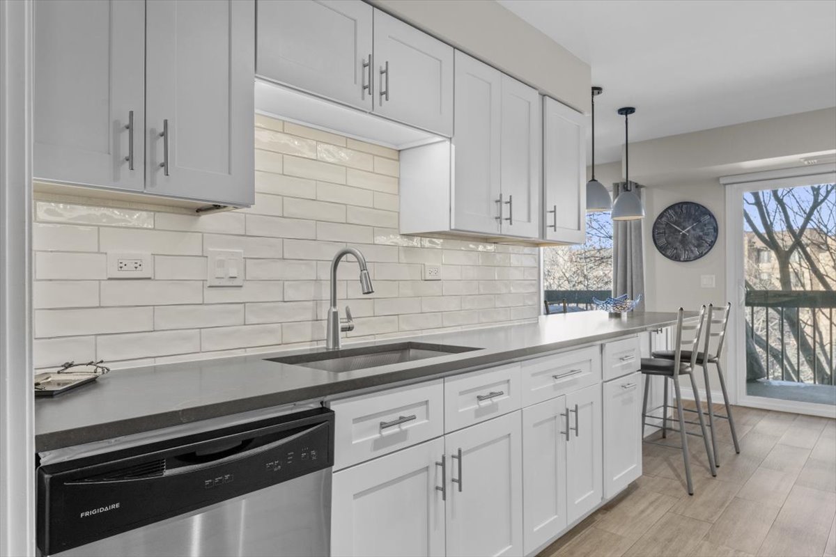 3741 Mission Hills Road, Unit 410 Northbrook, IL 60062 - Photo 4 of 21 a kitchen with appliances cabinets and a sink