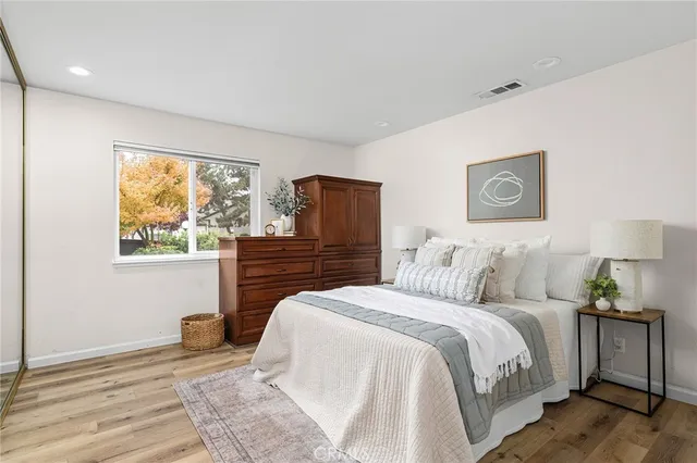 a room with a bed and a table in it