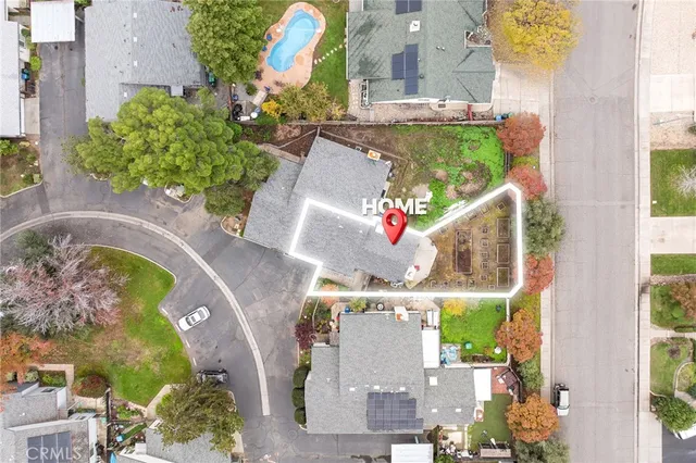 an aerial view of a house with a swimming pool