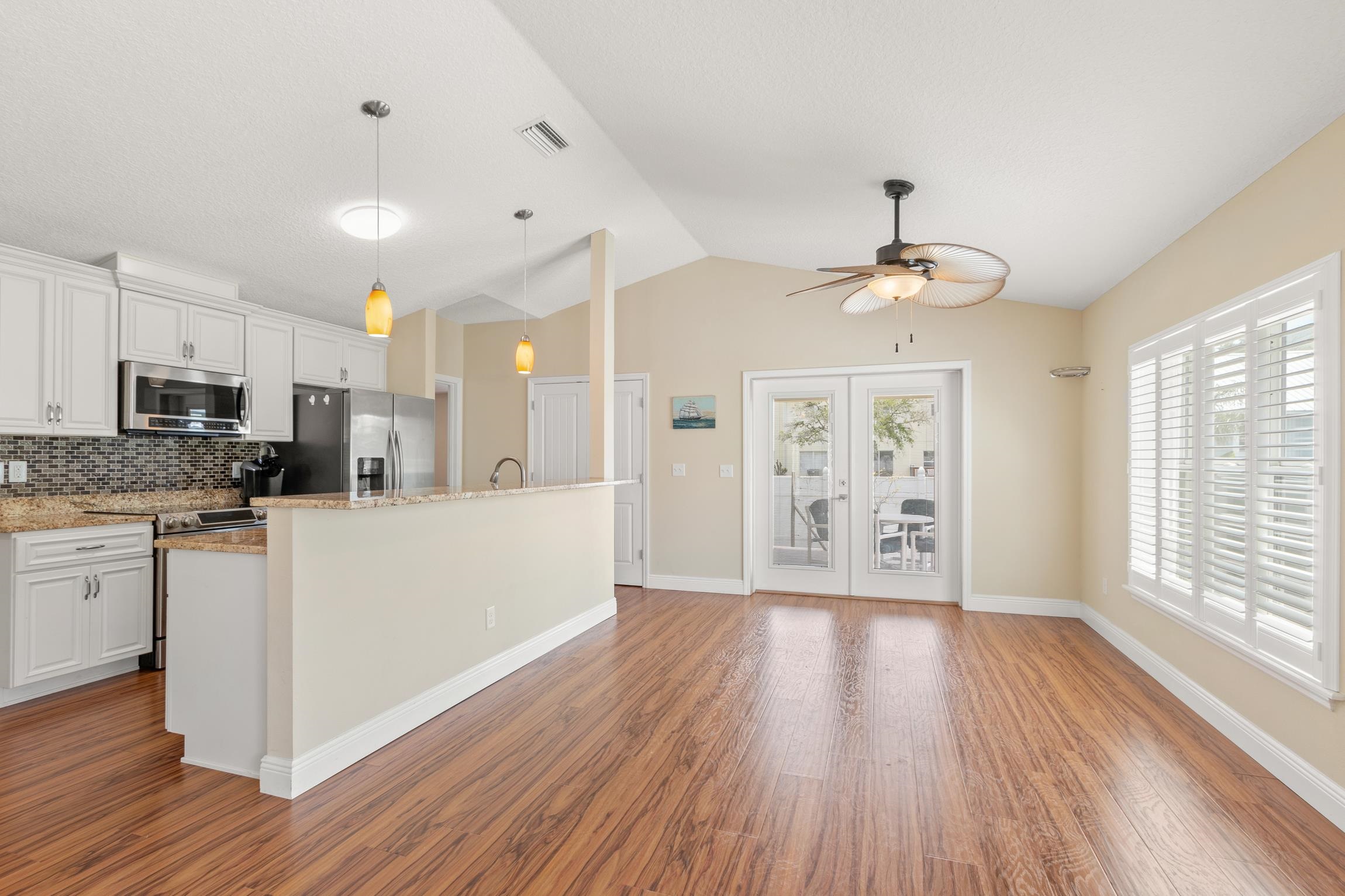 32 Comares Avenue St. Augustine, FL 32080 - Photo 13 of 43 a large kitchen with cabinets wooden floor and stainless steel appliances
