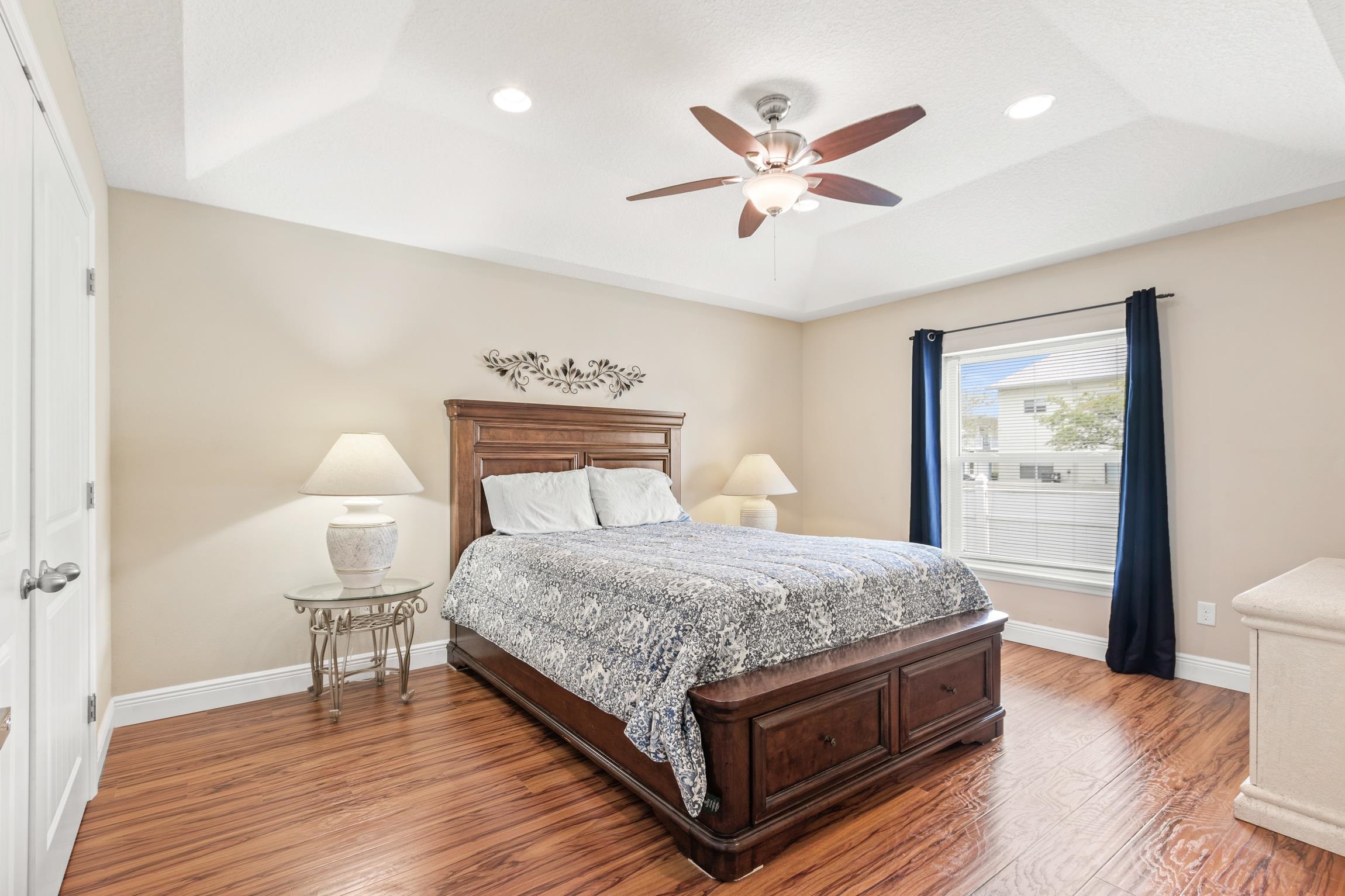 32 Comares Avenue St. Augustine, FL 32080 - Photo 19 of 43 a bedroom with a bed and a lamp on table