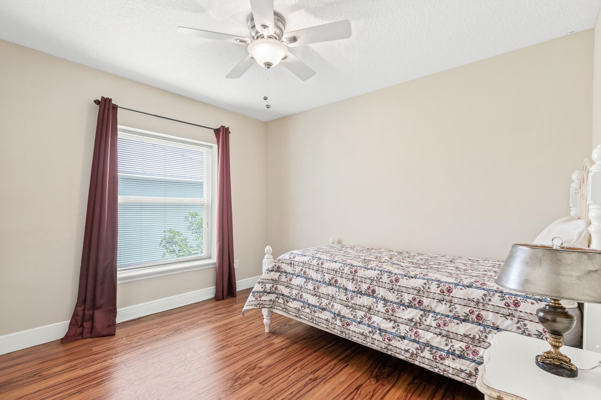 32 Comares Avenue St. Augustine, FL 32080 - Photo 20 of 43 a bedroom with a bed and wooden floor