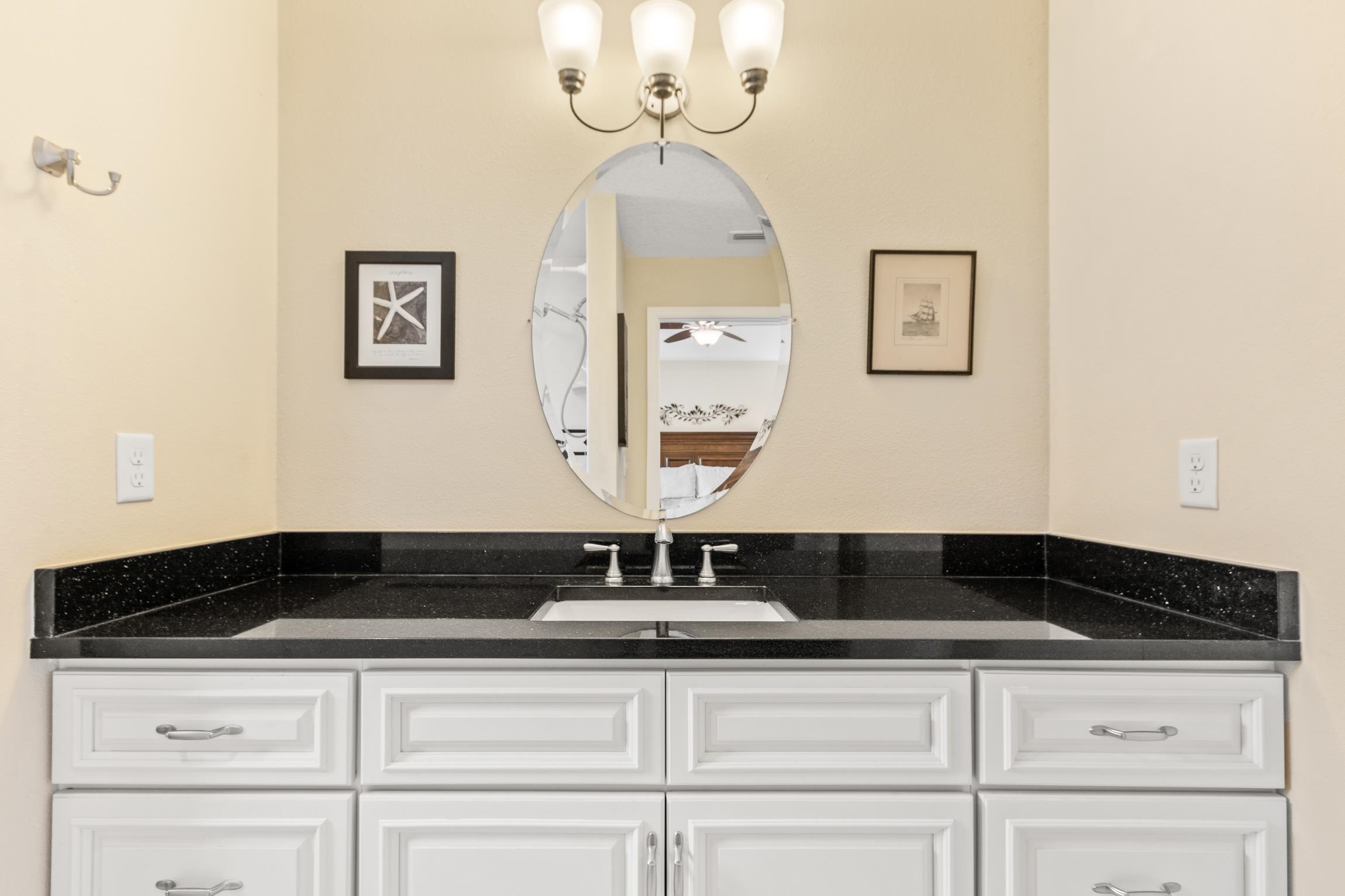 32 Comares Avenue St. Augustine, FL 32080 - Photo 24 of 43 a close view of a sink a mirror and cabinets in a kitchen