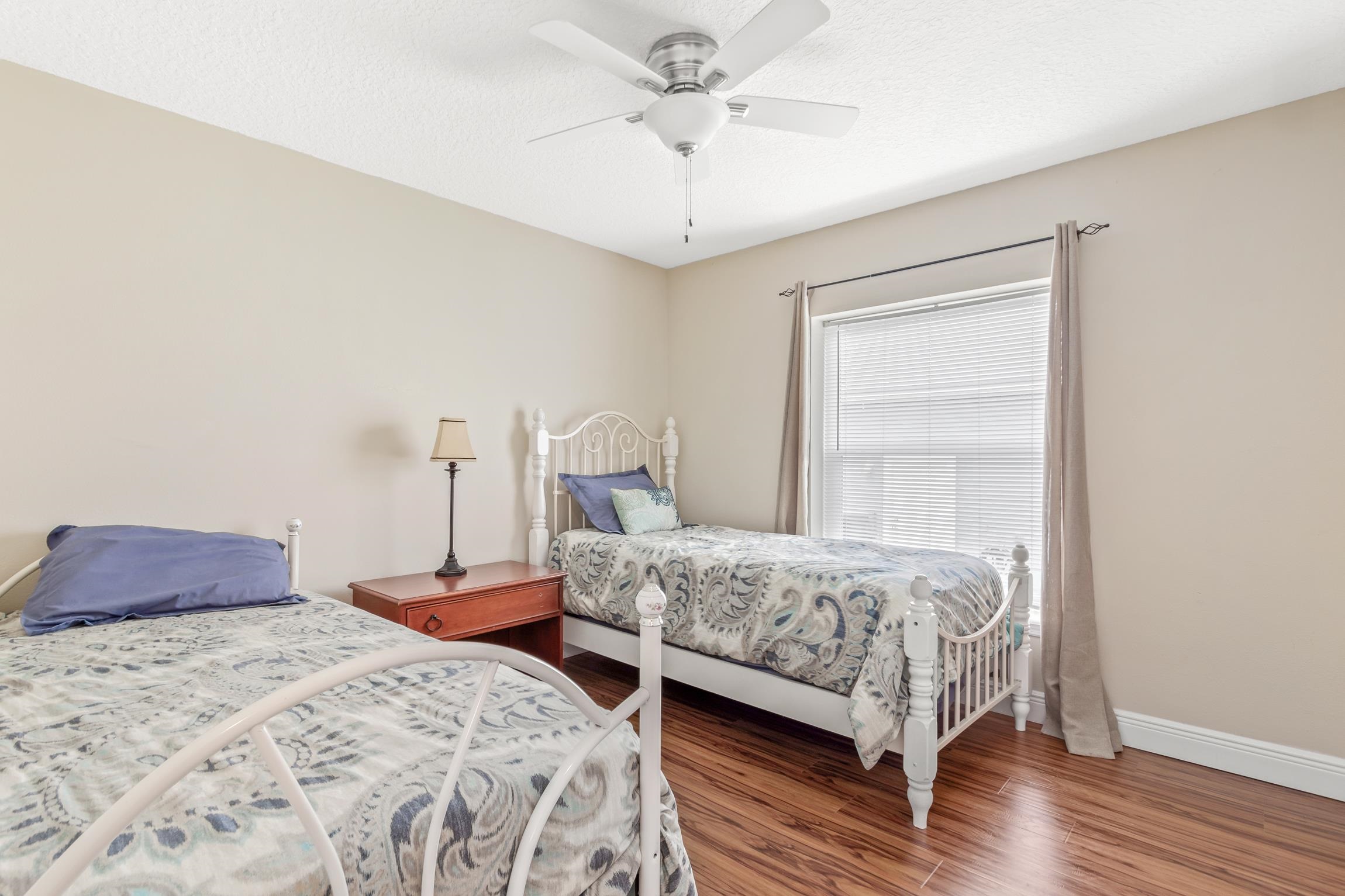 32 Comares Avenue St. Augustine, FL 32080 - Photo 28 of 43 a bedroom with a bed and a chandelier