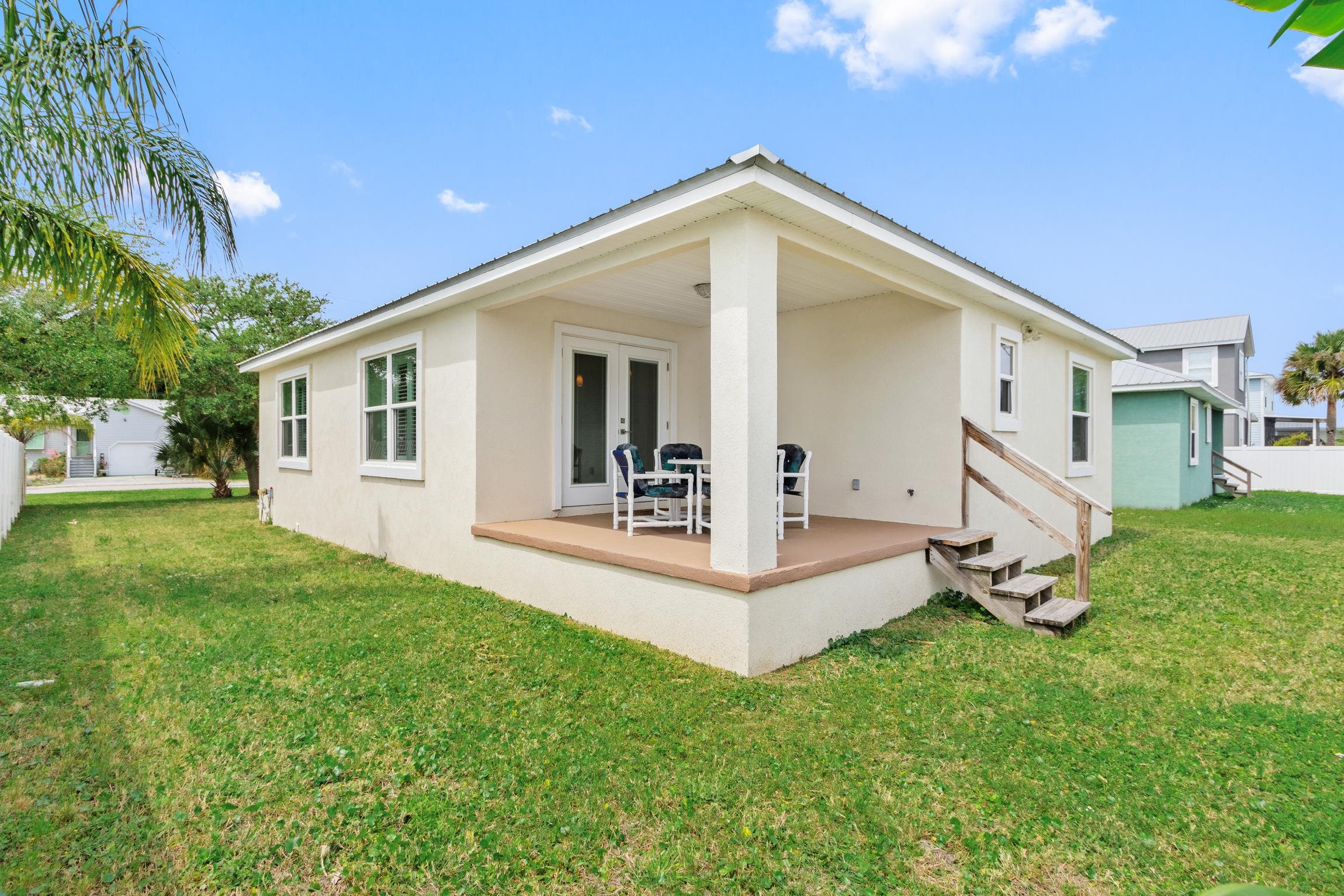 32 Comares Avenue St. Augustine, FL 32080 - Photo 32 of 43 a view of a house with backyard and a tree