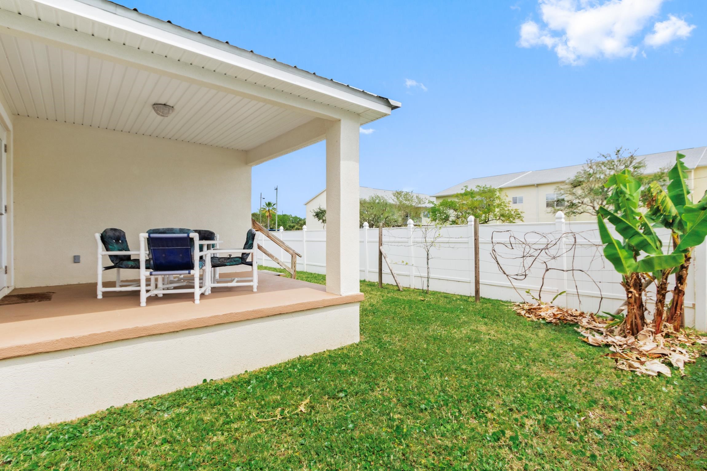 32 Comares Avenue St. Augustine, FL 32080 - Photo 33 of 43 a patio with table and chairs and potted plants
