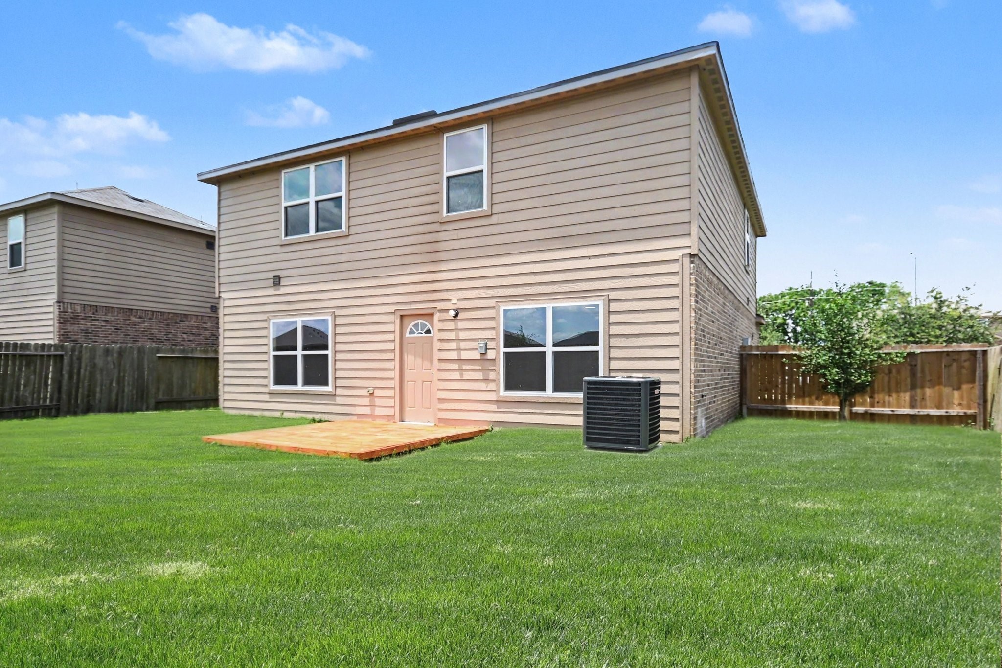 1322 Diamond Drape Drive Rosharon, TX 77583 - Photo 36 of 45 a backyard of a house with potted plants and a yard