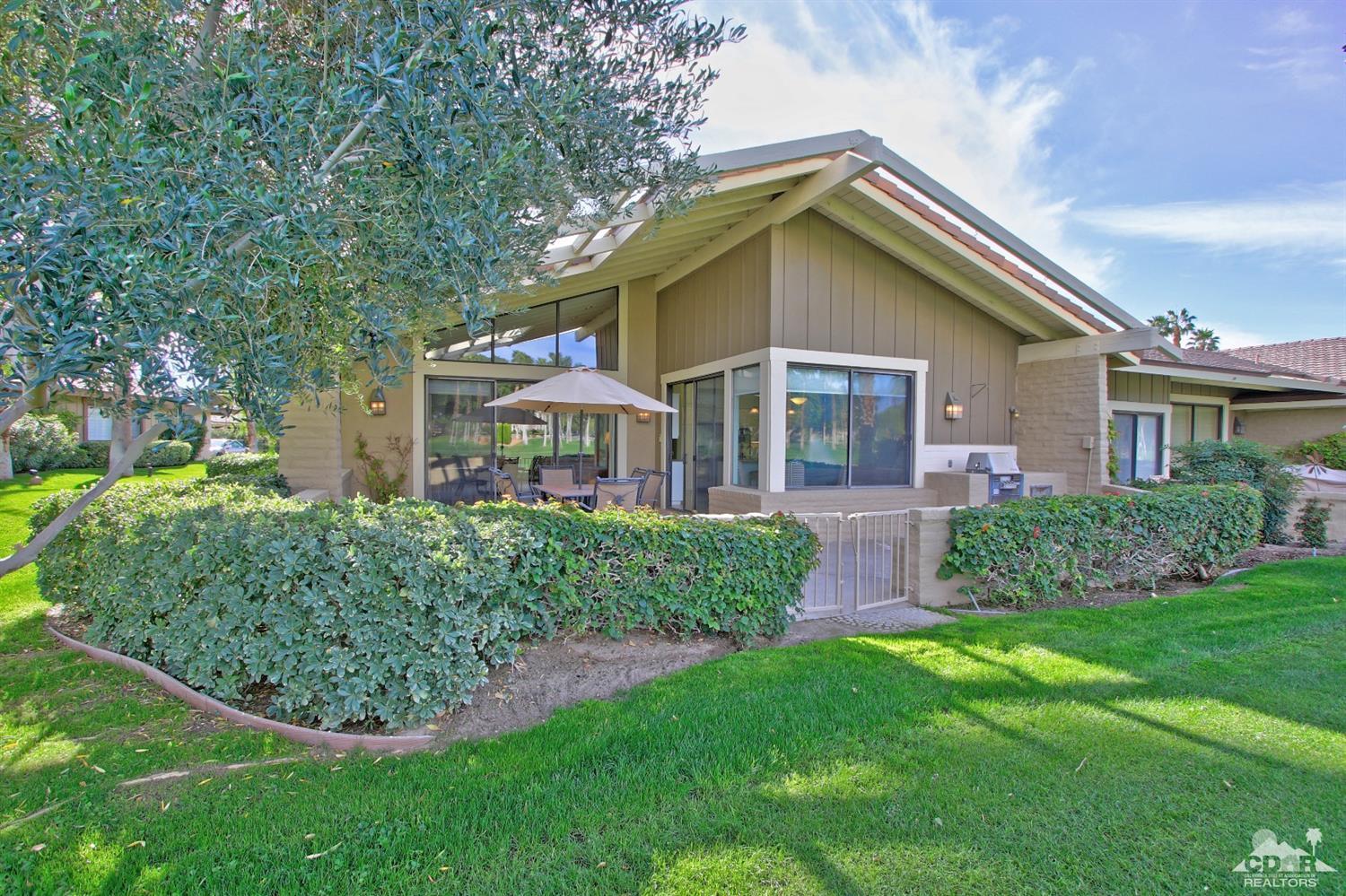 198 Ranch View Circle Palm Desert, CA 92211 - Photo 2 of 54 a front view of house with yard and green space