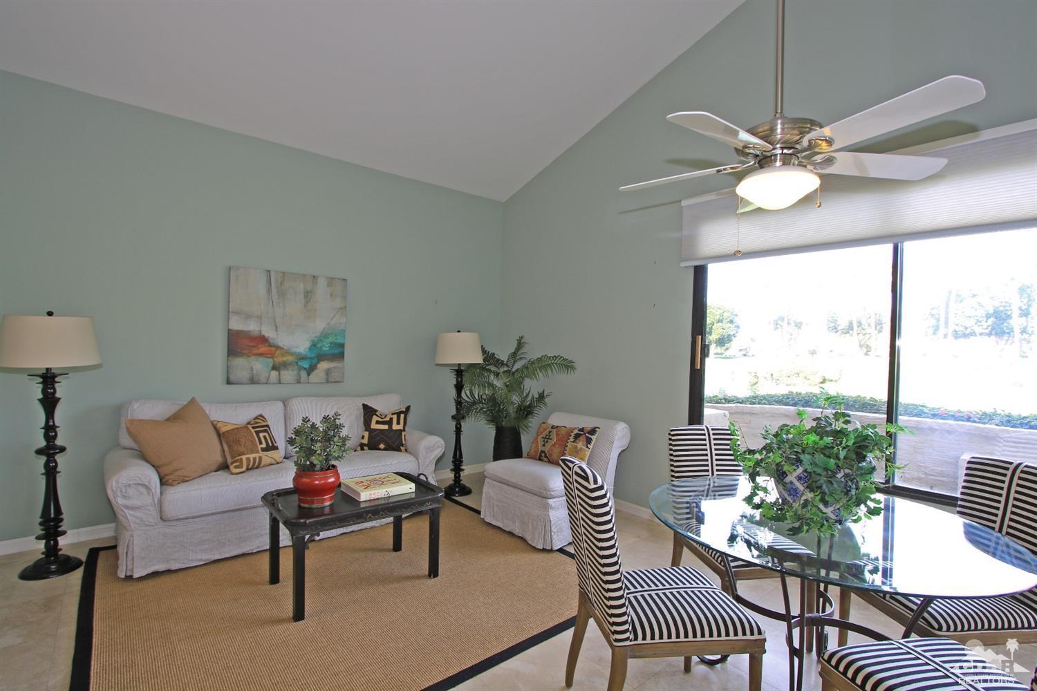 198 Ranch View Circle Palm Desert, CA 92211 - Photo 16 of 54 a living room with furniture and a chandelier