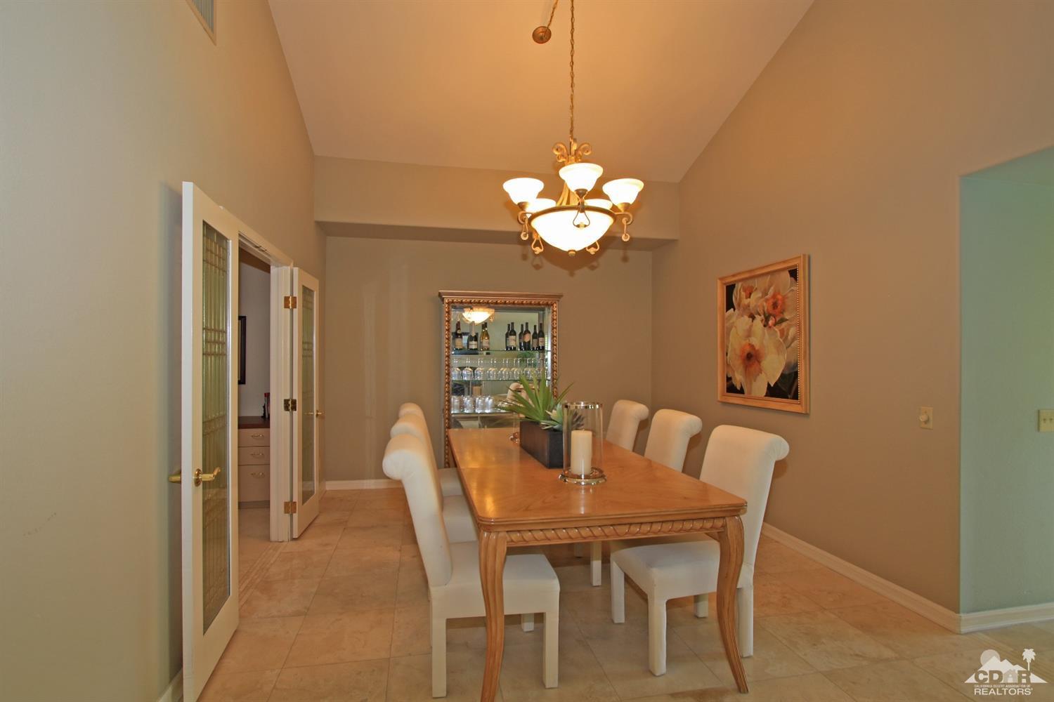 198 Ranch View Circle Palm Desert, CA 92211 - Photo 18 of 54 a view of a dining room with a table and chairs