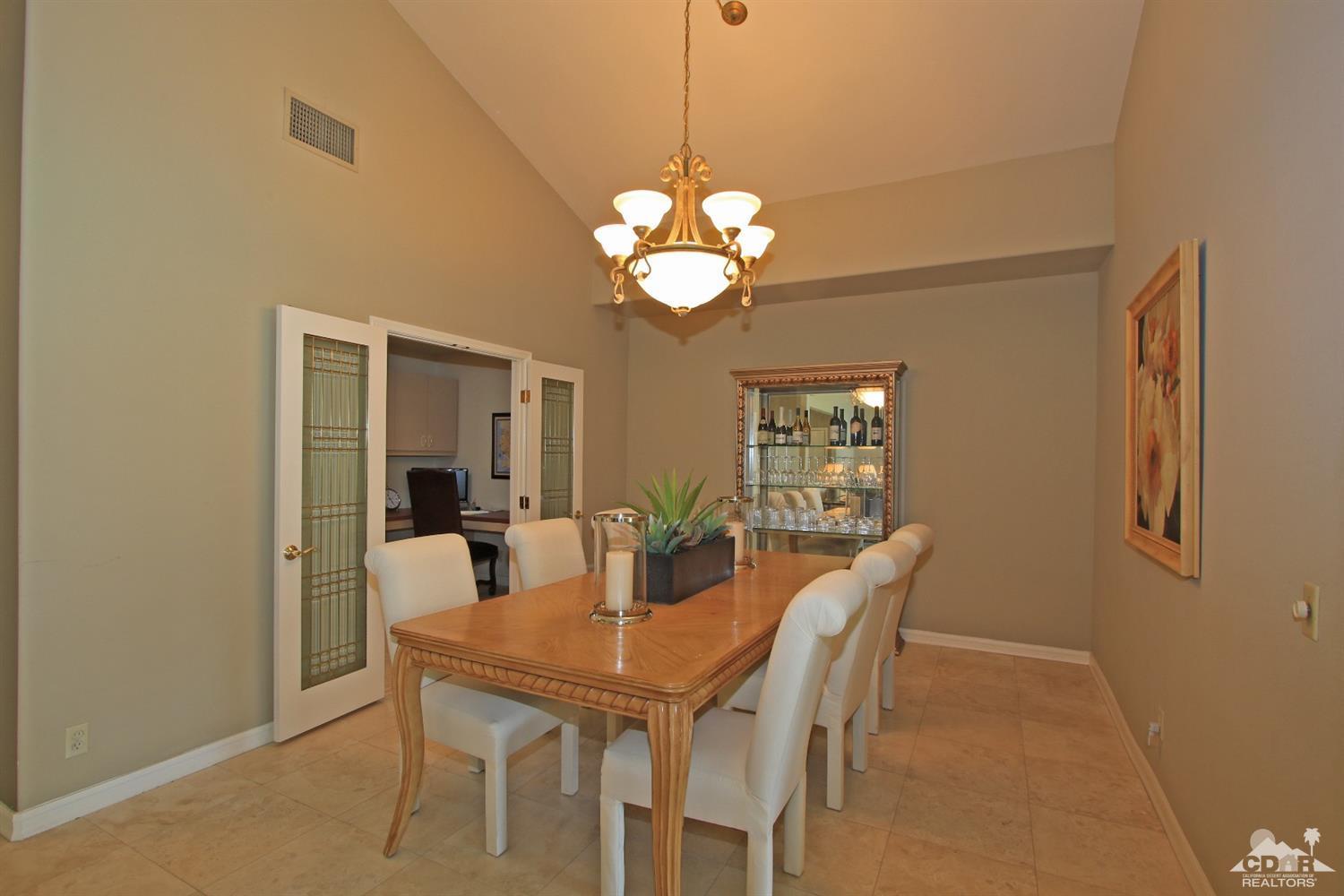 198 Ranch View Circle Palm Desert, CA 92211 - Photo 19 of 54 a view of a dining room with furniture and chandelier