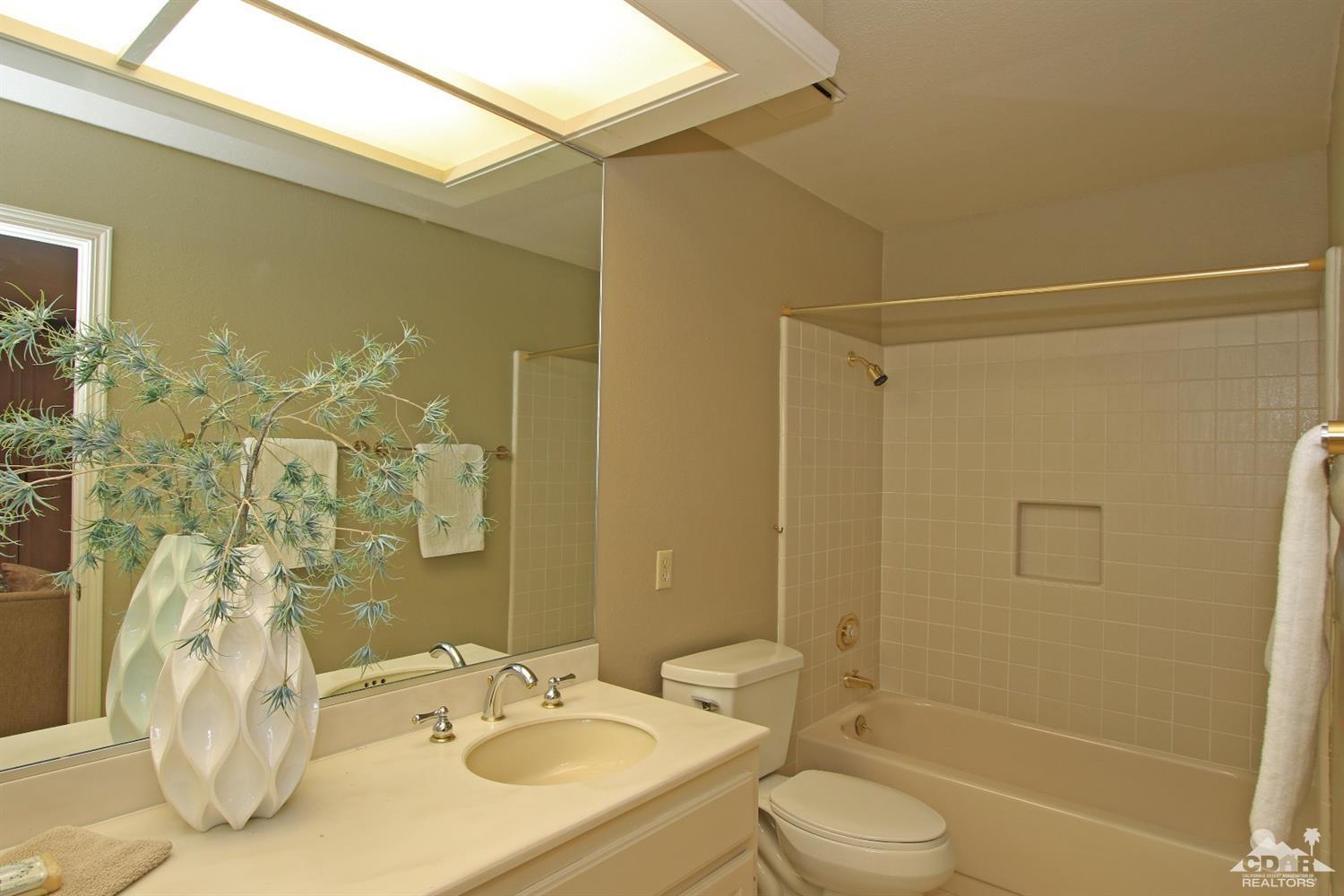 198 Ranch View Circle Palm Desert, CA 92211 - Photo 25 of 54 a bathroom with a granite countertop sink toilet and shower