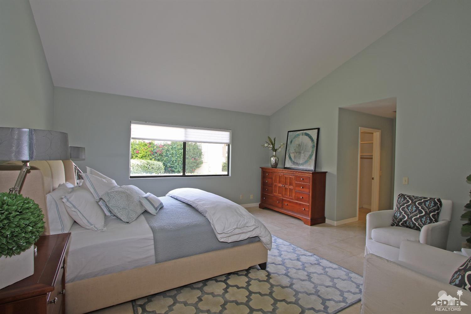 198 Ranch View Circle Palm Desert, CA 92211 - Photo 26 of 54 a bed room with a bed and couch