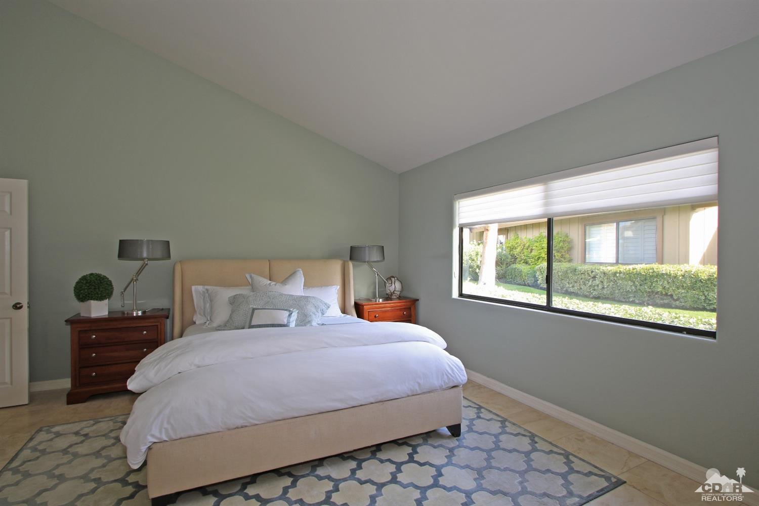 198 Ranch View Circle Palm Desert, CA 92211 - Photo 28 of 54 a bedroom with a bed and window