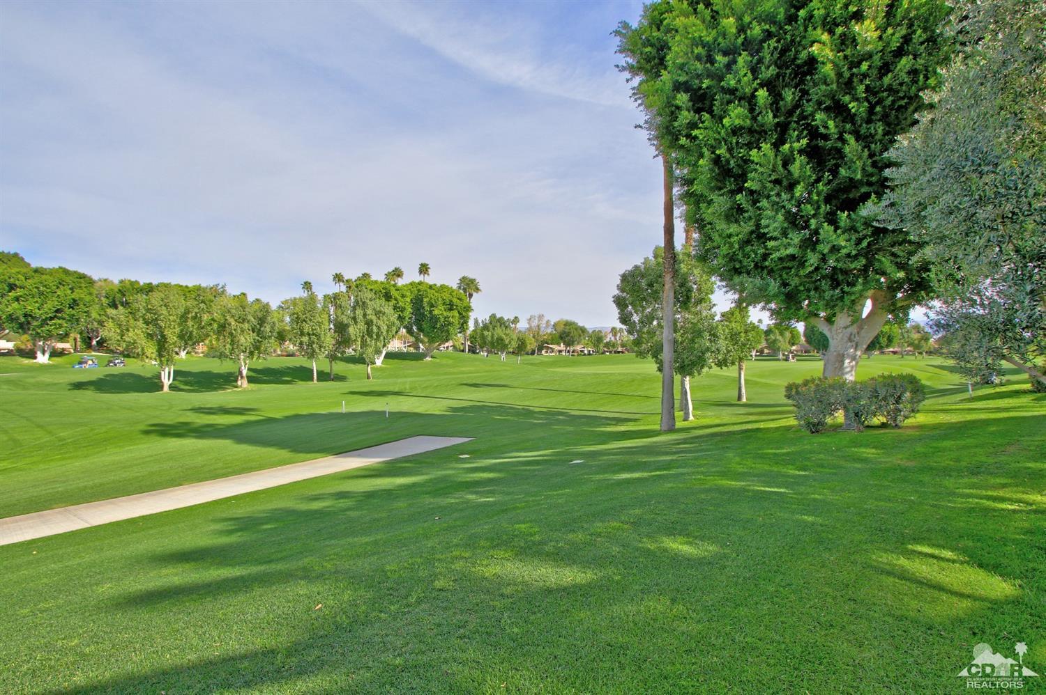 198 Ranch View Circle Palm Desert, CA 92211 - Photo 46 of 54 a garden with trees in the background