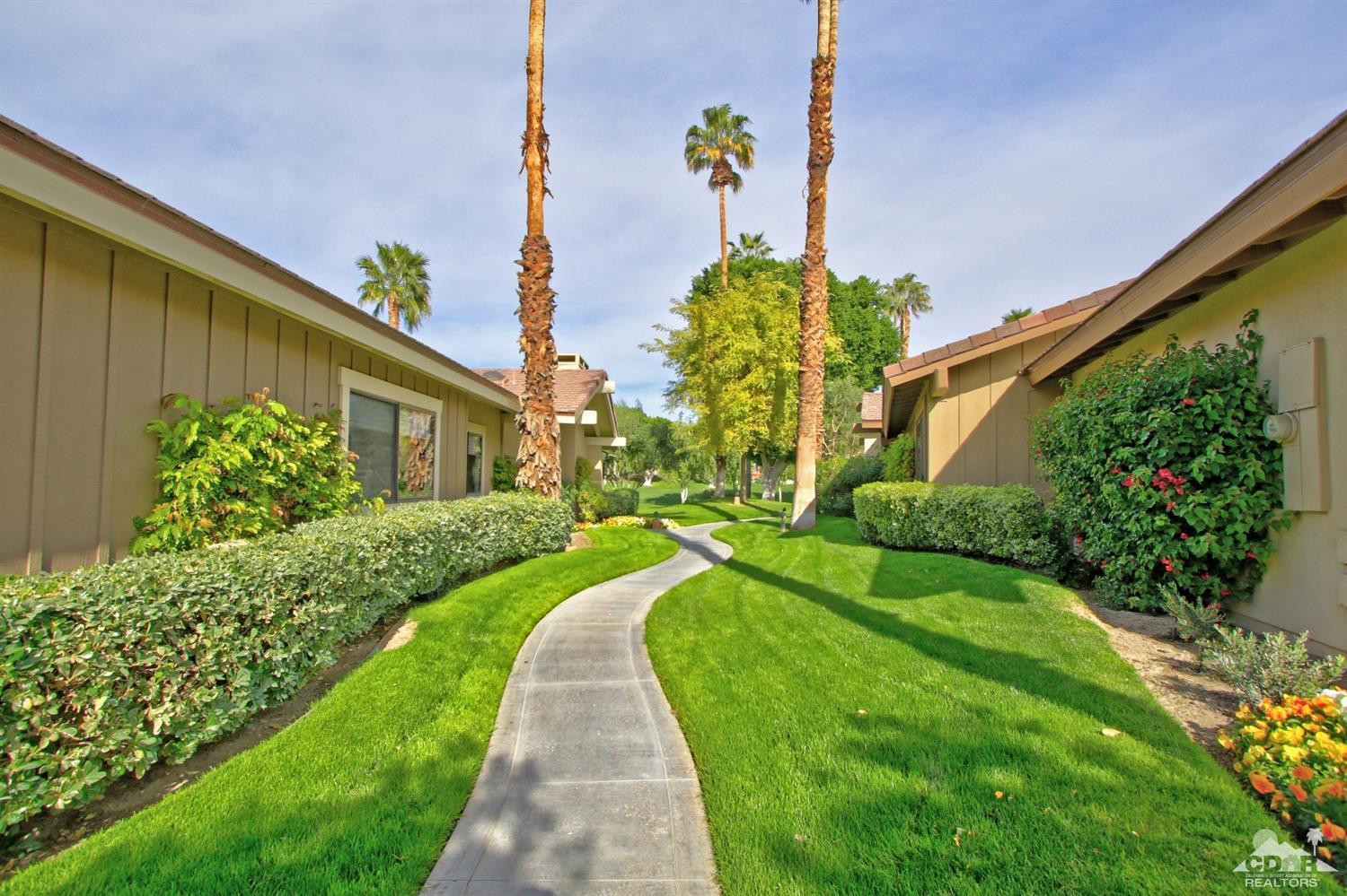198 Ranch View Circle Palm Desert, CA 92211 - Photo 49 of 54 a front view of a house with a yard