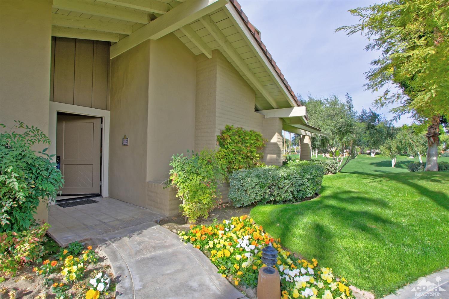 198 Ranch View Circle Palm Desert, CA 92211 - Photo 50 of 54 a front view of a house with a yard