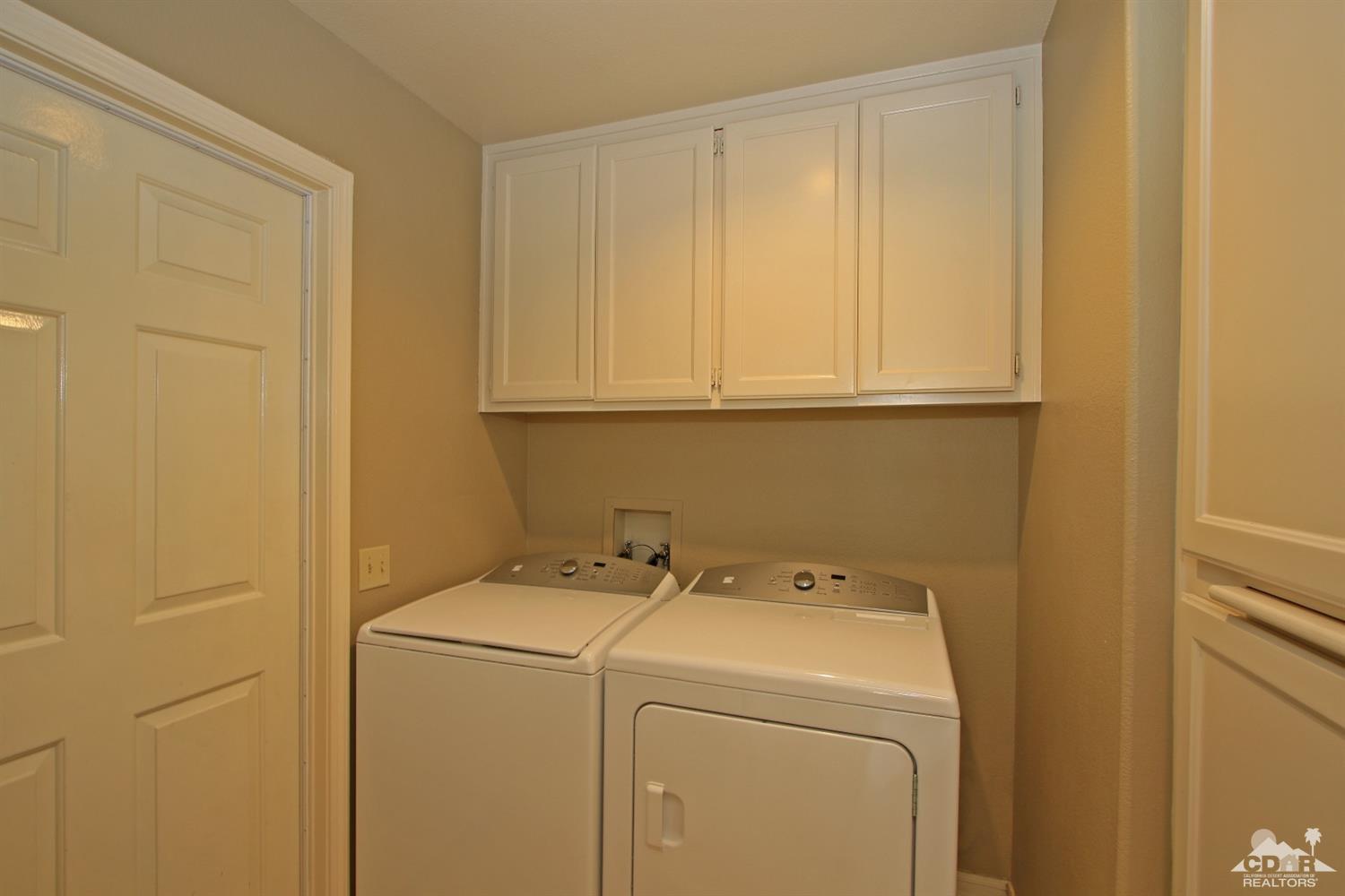 198 Ranch View Circle Palm Desert, CA 92211 - Photo 51 of 54 a utility room with dryer and washer