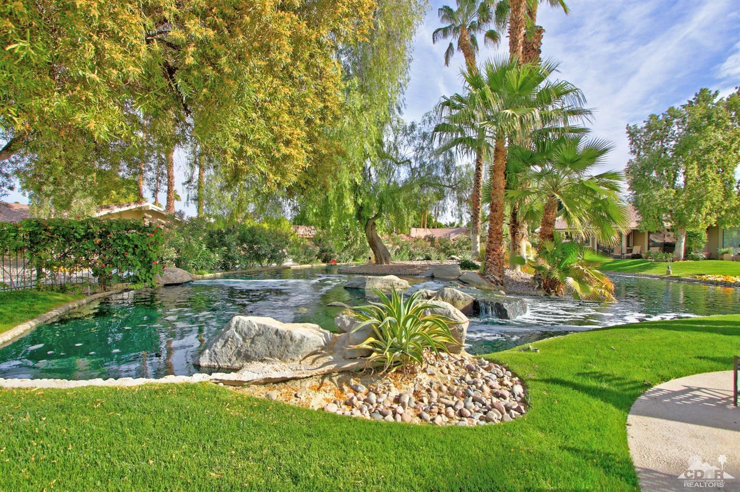 198 Ranch View Circle Palm Desert, CA 92211 - Photo 54 of 54 a view of a garden with a lake