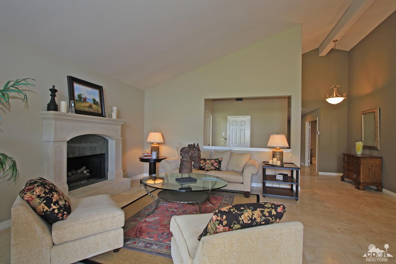 198 Ranch View Circle Palm Desert, CA 92211 - Photo 8 of 54 a living room with furniture and a fireplace
