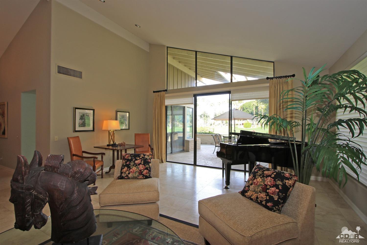 198 Ranch View Circle Palm Desert, CA 92211 - Photo 9 of 54 a living room with furniture and a large window