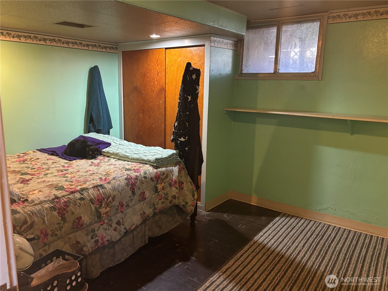 644 Balm Street Walla Walla, WA 99362 - Photo 17 of 21 a bed sitting in a bedroom next to a window