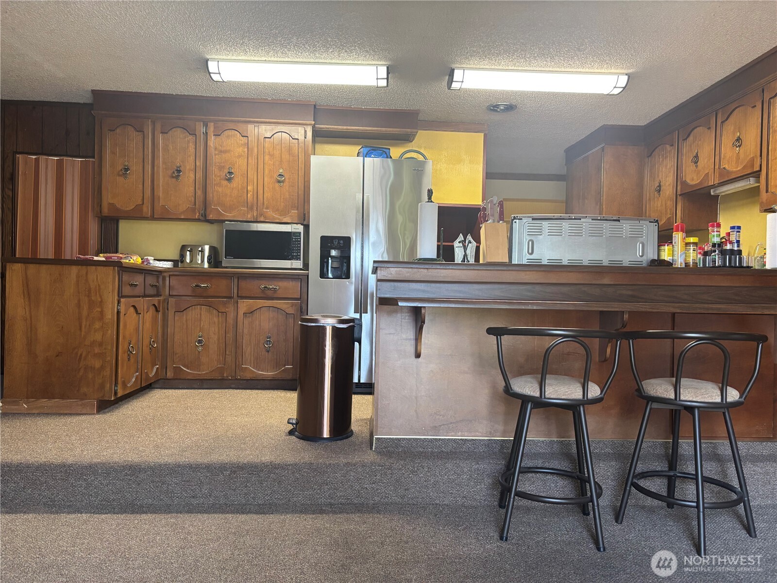 644 Balm Street Walla Walla, WA 99362 - Photo 6 of 21 a kitchen with cabinets and chairs