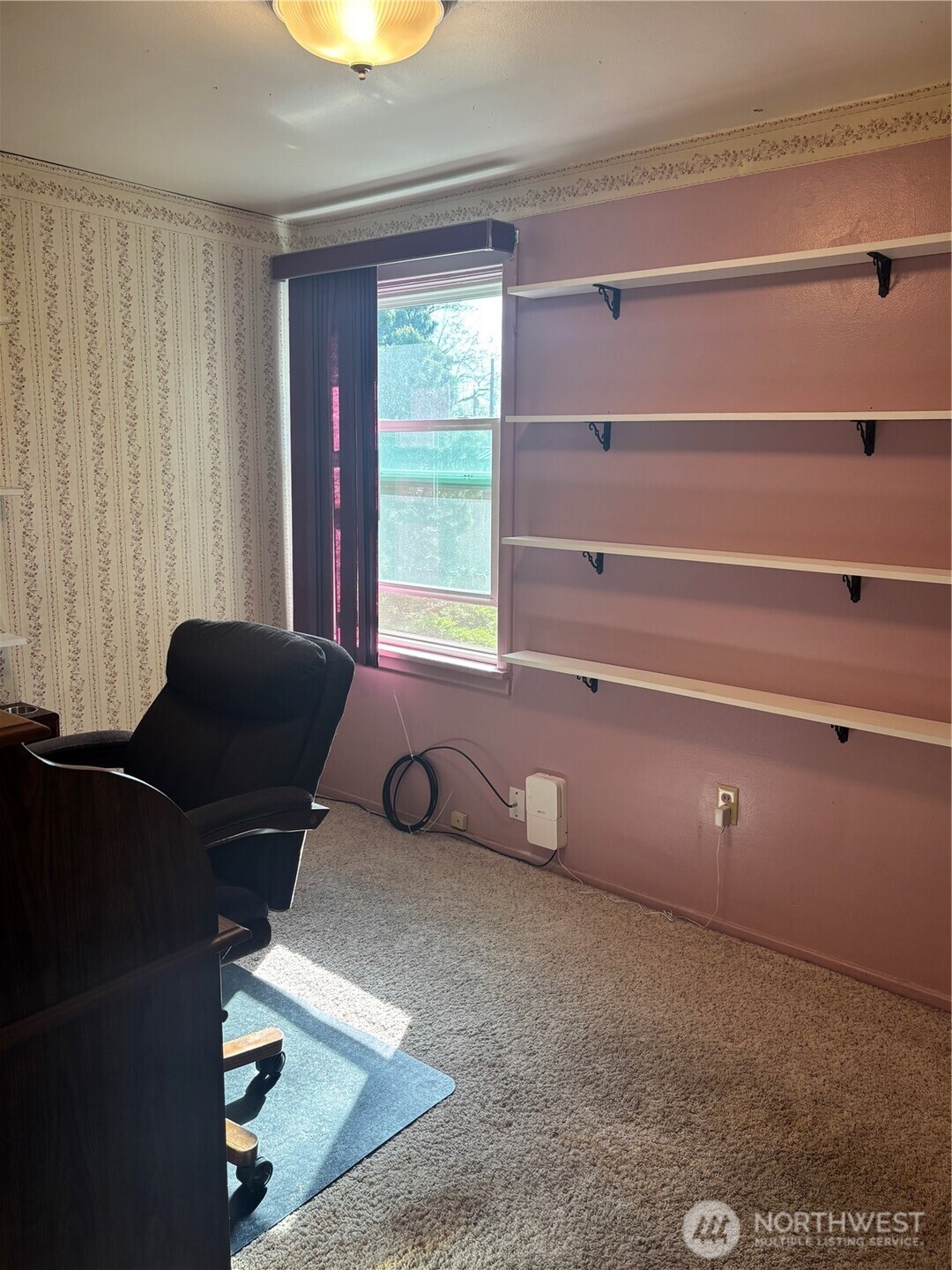 644 Balm Street Walla Walla, WA 99362 - Photo 9 of 21 a living room with couches and a bookshelf with wooden floor