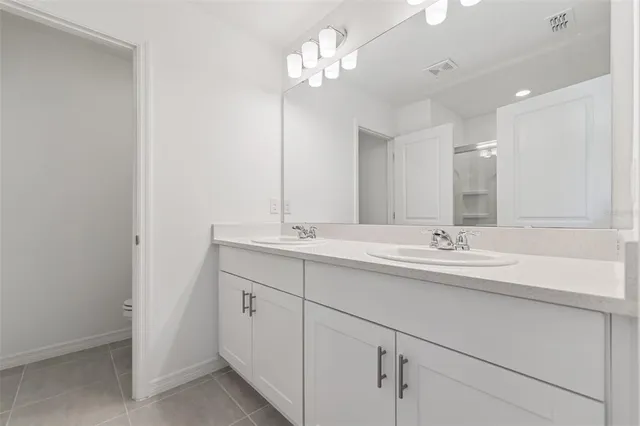 a bathroom with a sink a vanity and a mirror