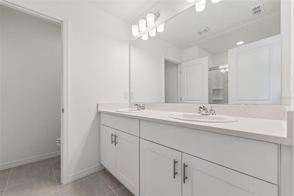 188 Jones Fish Camp Road Edgewater, FL 32141 - Photo 16 of 34 a bathroom with a sink a vanity and a mirror