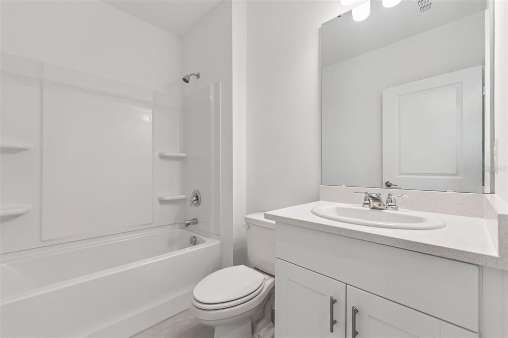 188 Jones Fish Camp Road Edgewater, FL 32141 - Photo 23 of 34 a bathroom with a sink toilet vanity and shower