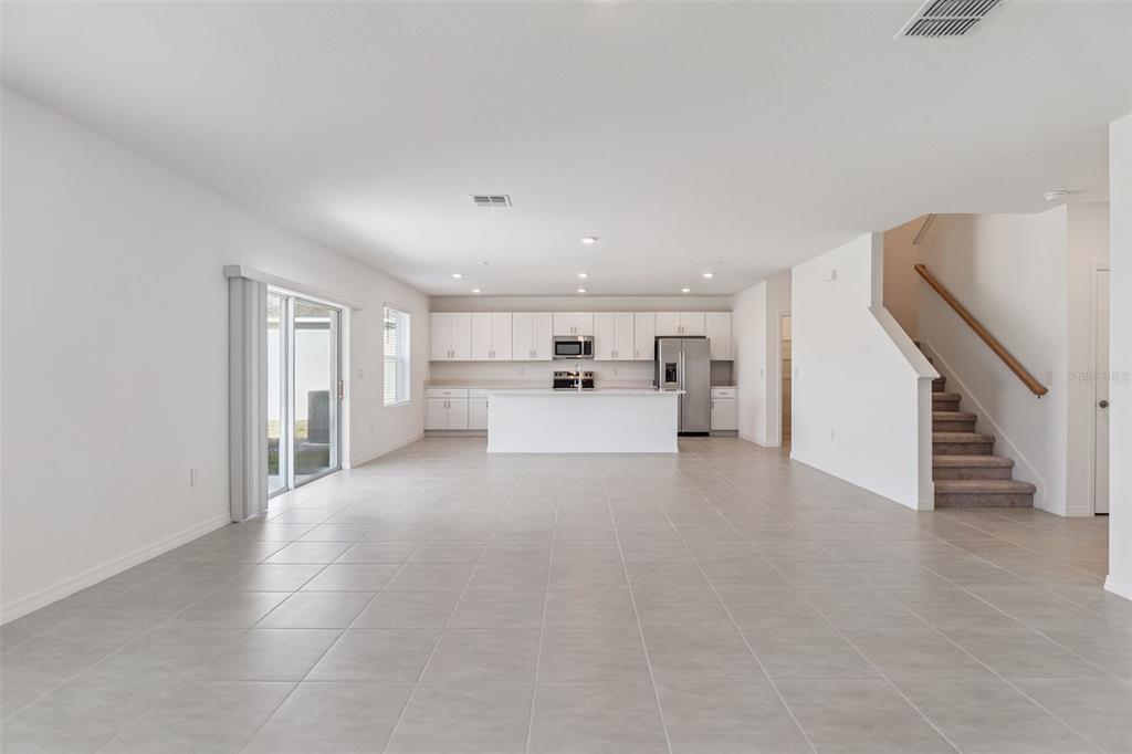 188 Jones Fish Camp Road Edgewater, FL 32141 - Photo 4 of 34 a view of a livingroom with furniture and an empty room