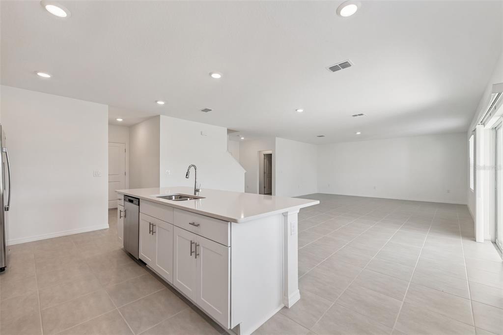 188 Jones Fish Camp Road Edgewater, FL 32141 - Photo 8 of 34 a kitchen with a sink and a stove top oven