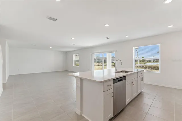 a kitchen with a sink and cabinets