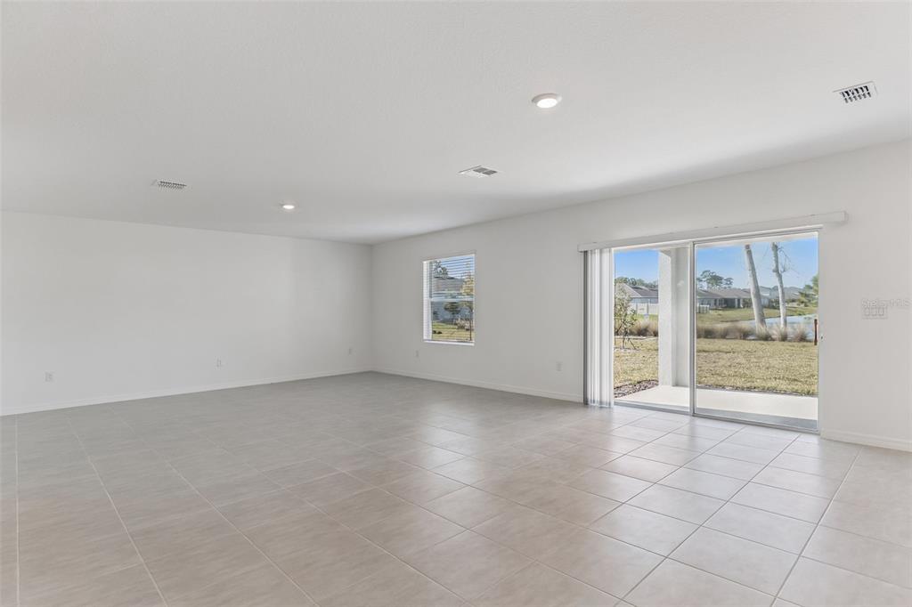 188 Jones Fish Camp Road Edgewater, FL 32141 - Photo 10 of 34 an empty room with windows