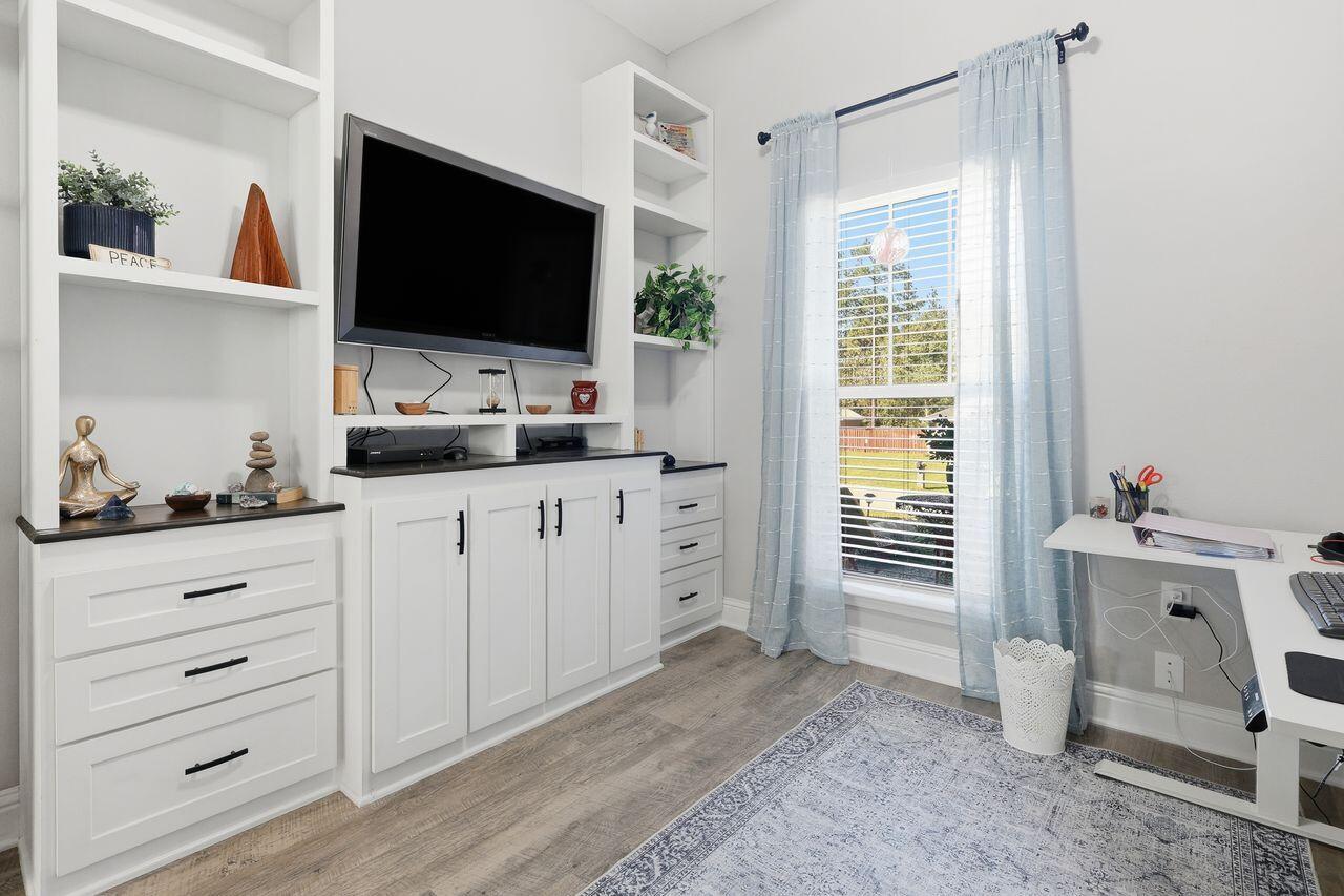 3025 Crown Creek Circle Crestview, FL 32539 - Photo 21 of 46 a room with cabinets and flat screen tv