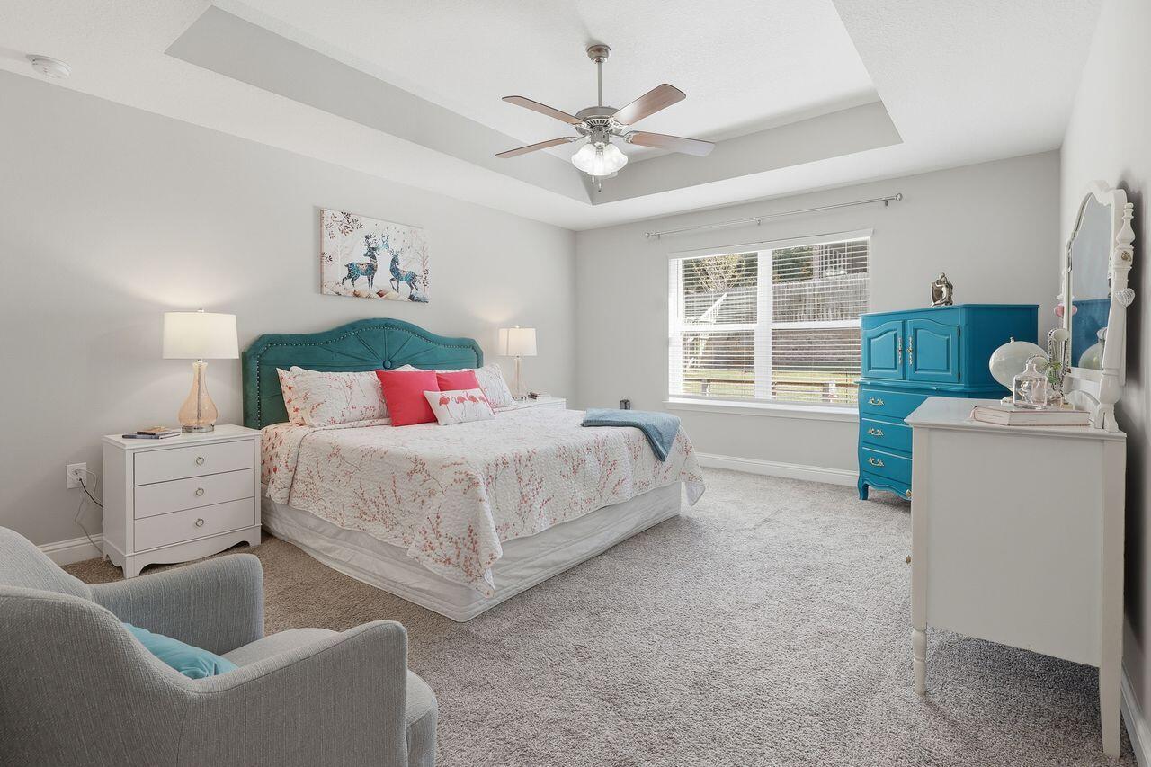 3025 Crown Creek Circle Crestview, FL 32539 - Photo 23 of 46 a bedroom with a bed and a couch