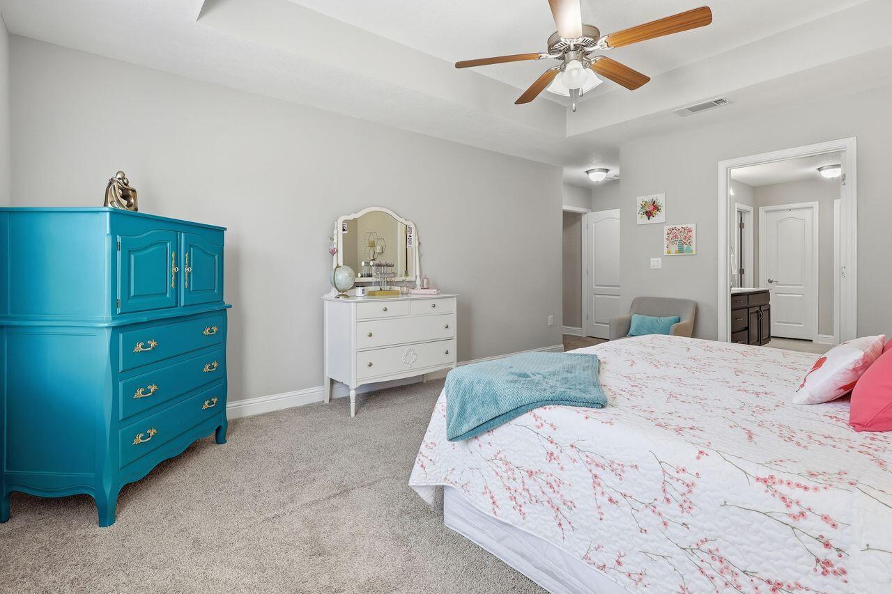 3025 Crown Creek Circle Crestview, FL 32539 - Photo 24 of 46 a bedroom with a bed and a dresser