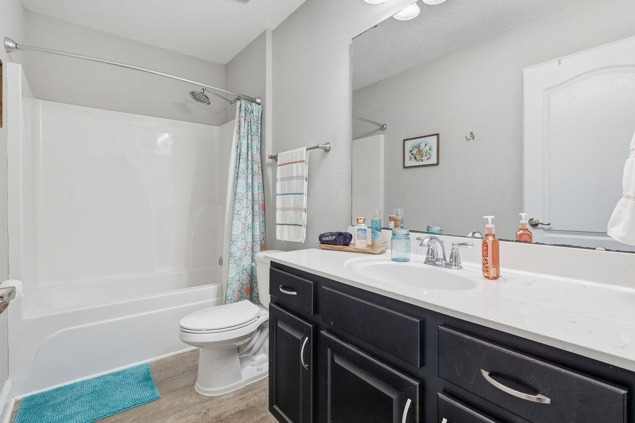 3025 Crown Creek Circle Crestview, FL 32539 - Photo 33 of 46 a bathroom with a sink a toilet and shower