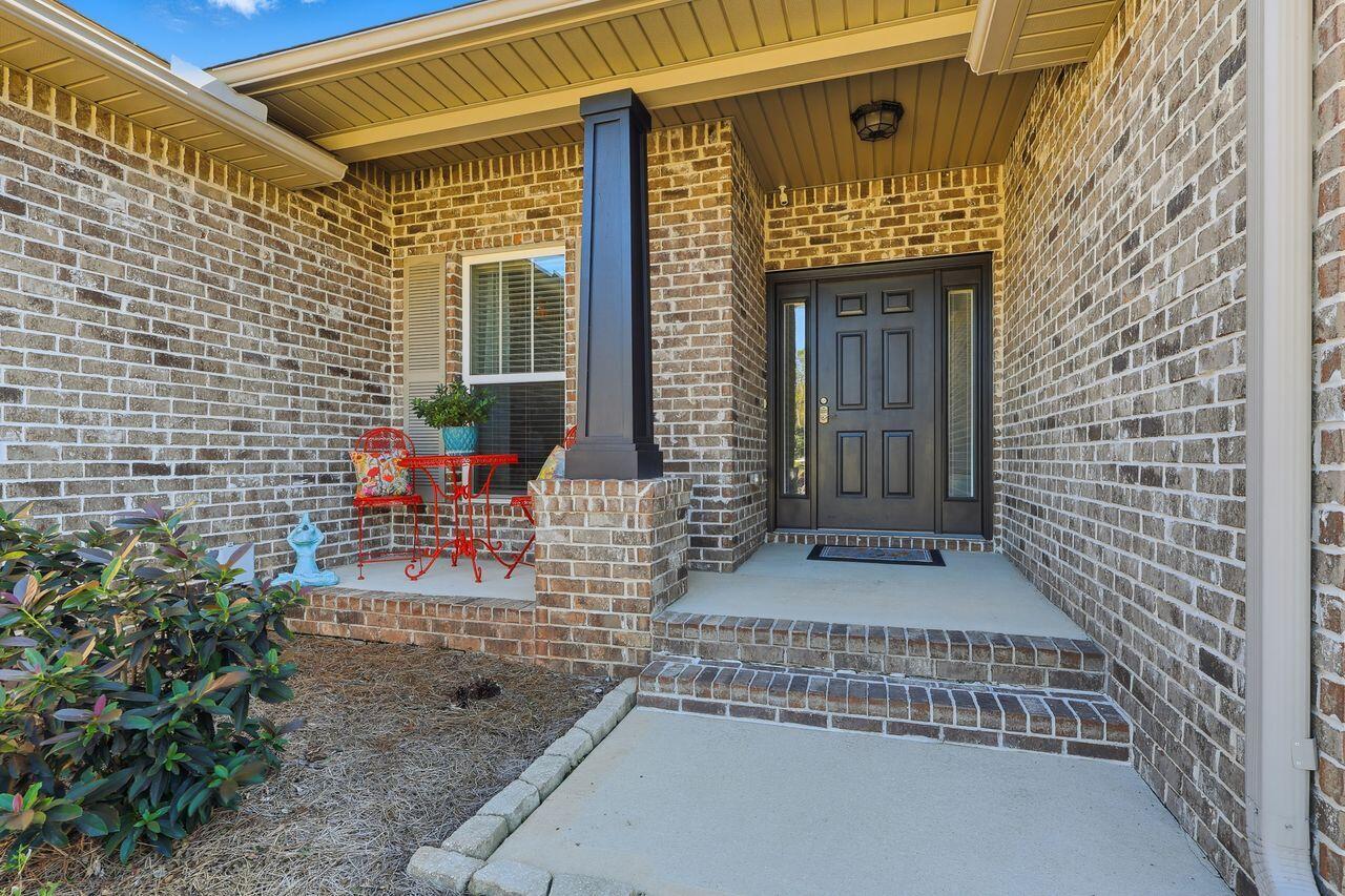 3025 Crown Creek Circle Crestview, FL 32539 - Photo 4 of 46 a front view of a house with outdoor seating